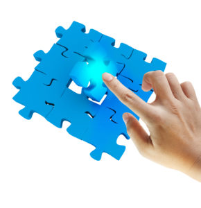 puzzle with hand pushing in last piece of digital marketing puzzle 
