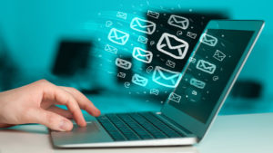 laptop with email icons used for email marketing