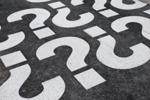 question marks painted on a asphalt road surface signifying seo questions