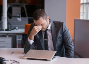 frustrated young business man irritated that content marketing isn't working