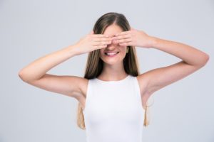 woman covering her eyes not looking at company websites