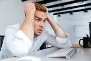 young businessman upset because of drop in website traffic